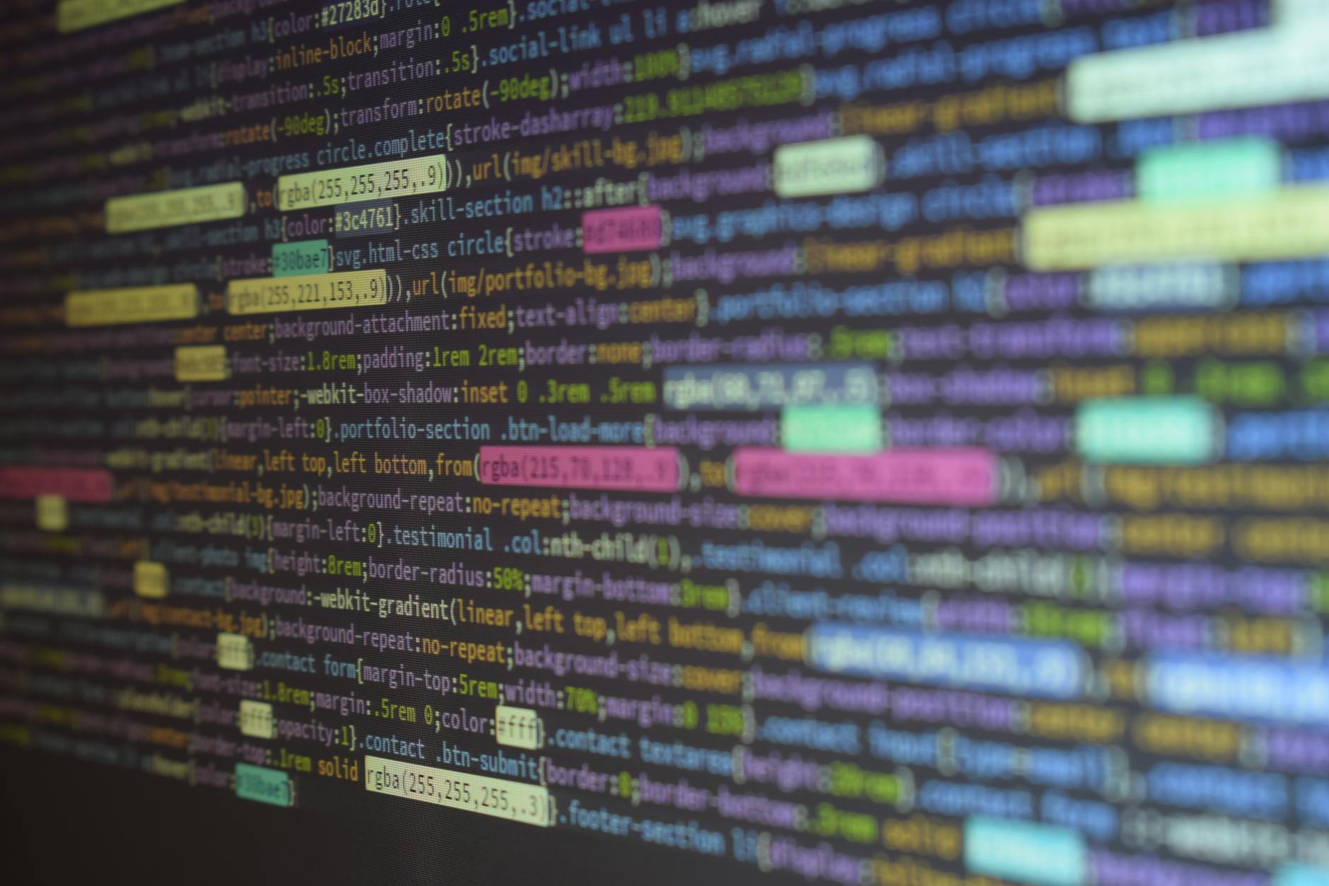 Close-up of colorful source code on a monitor, showcasing programming and technology concepts. (Photo by Abdul Kayum on Pexels)