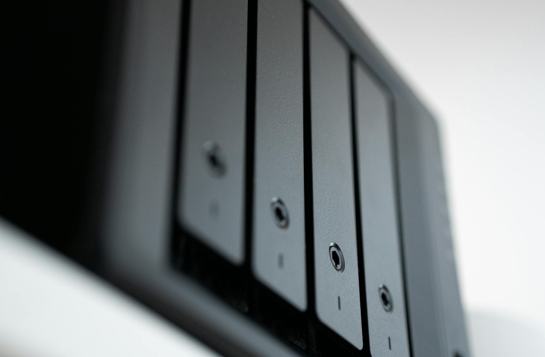 Detailed view of a black data storage unit highlighting modern technology and data management. (Photo by Jakub Zerdzicki on Pexels)