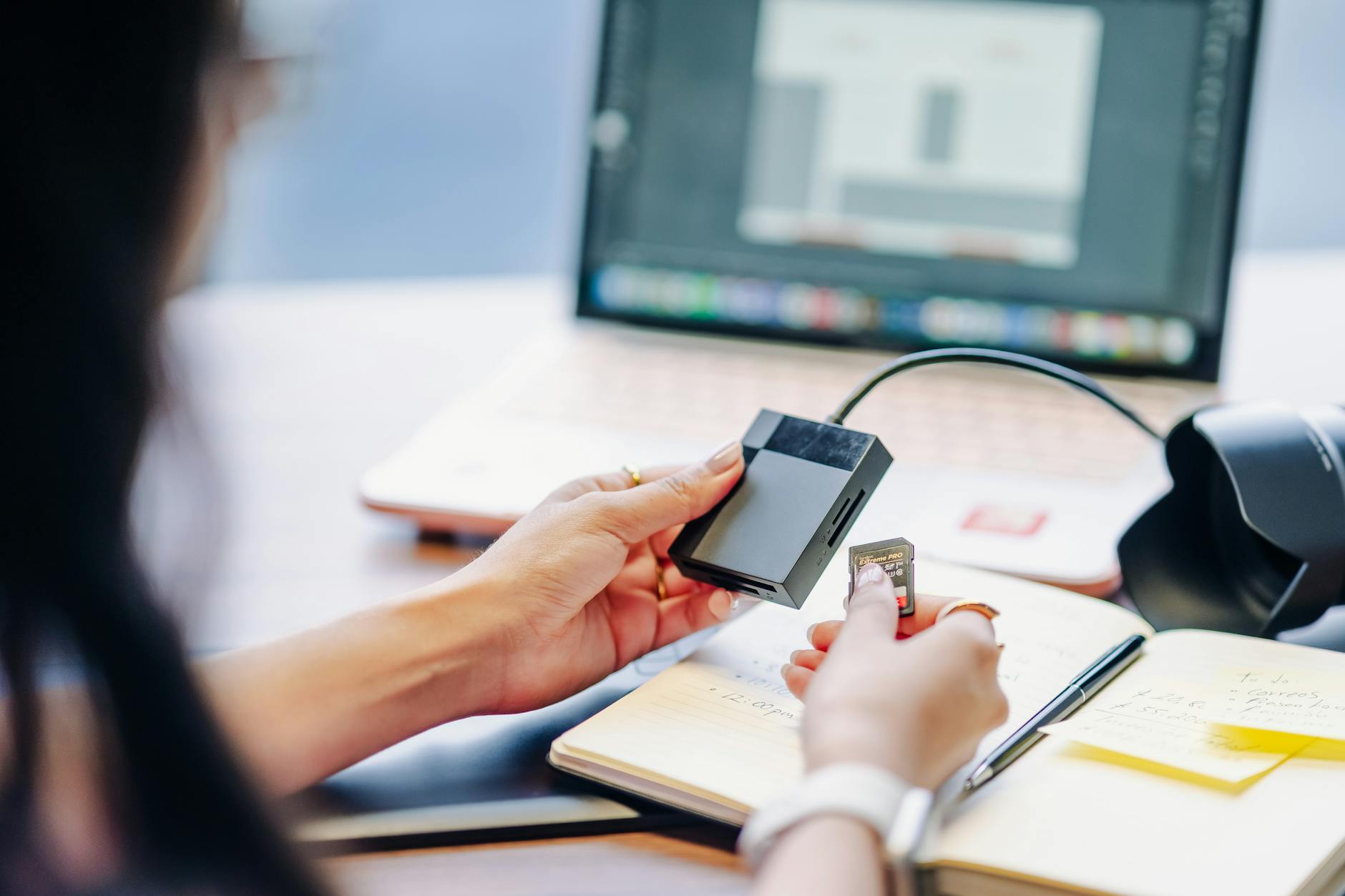 Close-up of a person using a card reader with a laptop, ideal for tech or remote work themes. (Photo by Julio Lopez on Pexels)