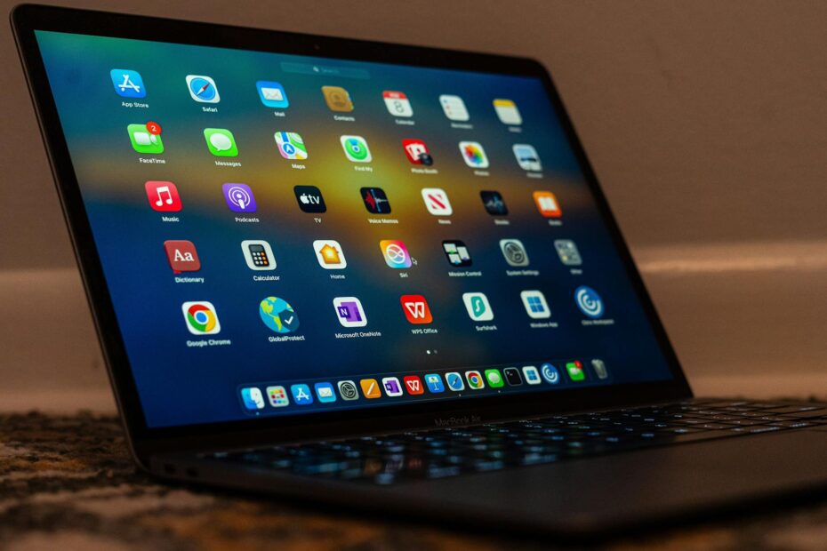 Close-up of a laptop screen showing various applications and colorful icons. (Photo by Sai M on Pexels)